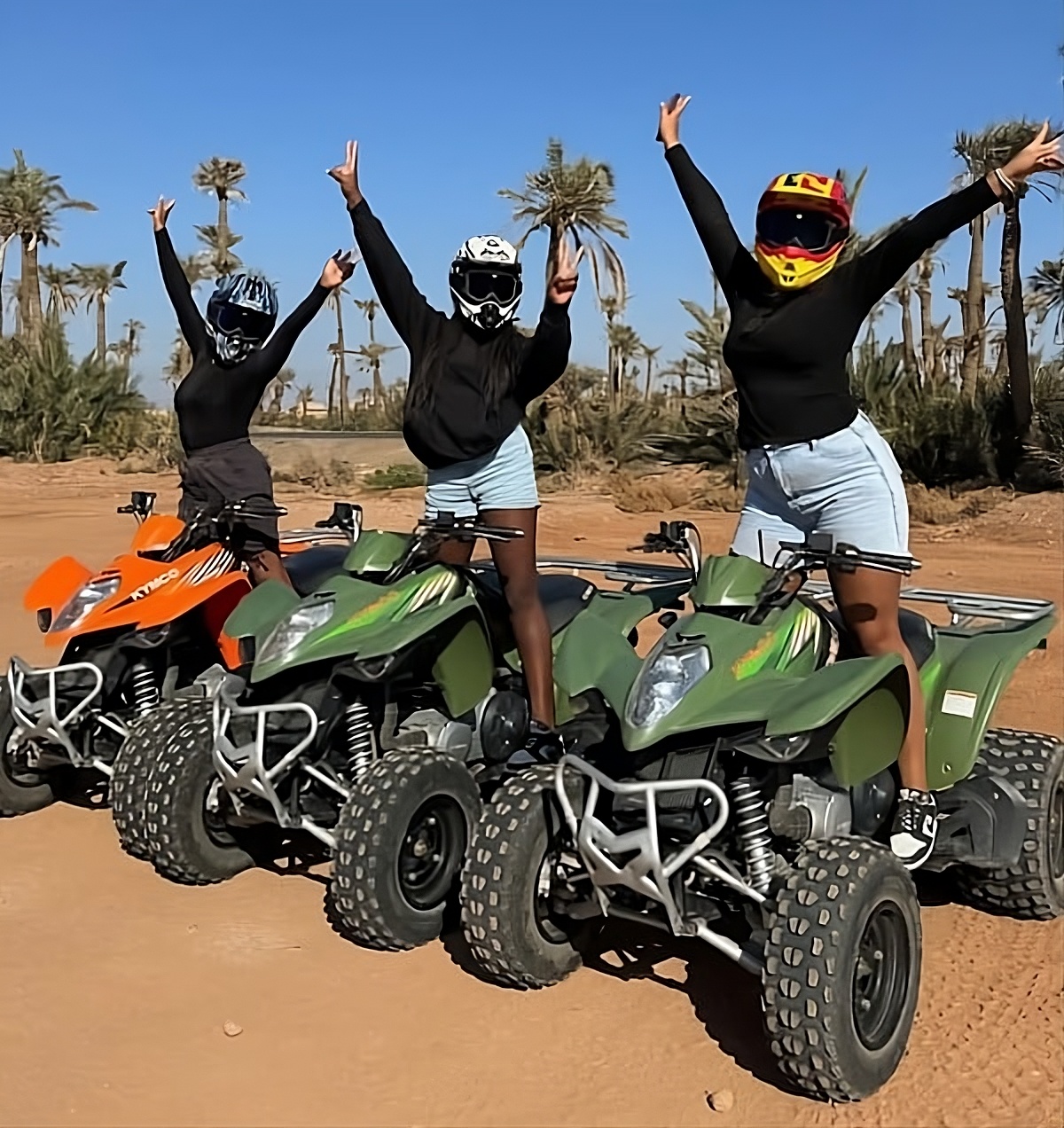 3 girls riding quad bikes in Marrakech, Morocco