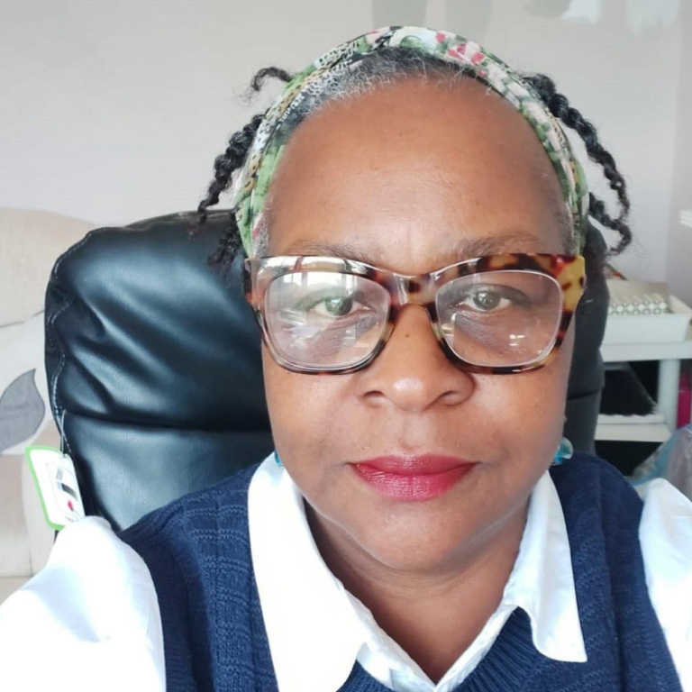 Photo of Winifred Eboh, a Black woman wearing thick-rimmed spectacles